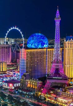 the eiffel tower lit up at night in las vegas