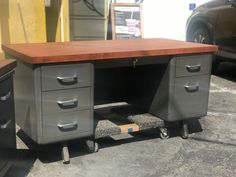 an office desk sitting on top of a parking lot