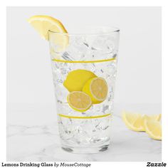 a glass with lemons and ice in it