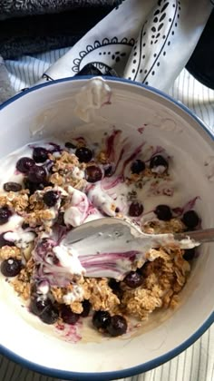 a bowl filled with granola and yogurt