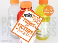 there are three bottles of juice and a sign that says quench your thirst for victory good luck