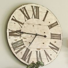 a clock on the wall with roman numerals