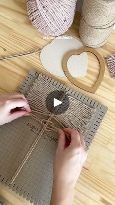 someone is making a card with twine and yarn