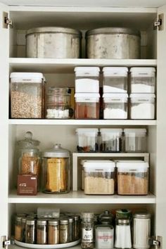 an organized pantry filled with lots of different types of spices and food items on shelves