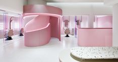 a room with pink walls and white floors