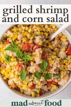 grilled shrimp and corn salad in a white bowl with text overlay that reads grilled shrimp and corn salad mad about food