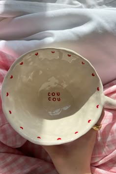 someone is holding up a bowl with the words go you on it