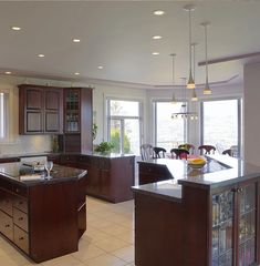 a large kitchen with an island in the middle