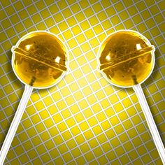 two orange lollipops sitting on top of a yellow table with checkered background