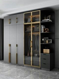 an empty room with grey walls and gold trim on the doors, black cabinets and drawers