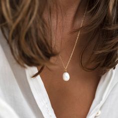 Featuring a baroque pearl on a silver chain, this necklace will glow against your skin like a drop of moonlight. The pearl measures 12-13mm and the adjustable chain can be worn at 17", 19" or 21".


Baroque pearls are irregular in shape, meaning your pearl will have its own unique shape! Silver Pearl Necklace, Chic Necklace, Baroque Pearl Necklace, Freshwater Cultured Pearls, Traditional Jewelry, Freshwater Pearl Necklaces, Simple Necklace, Stainless Steel Necklace, Baroque Pearls