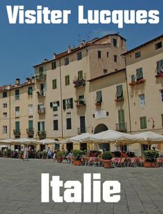 an italian town square with tables and umbrellas