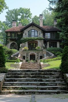 a large stone house with steps leading up to it