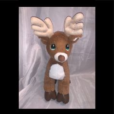 a stuffed deer with big antlers on it's head