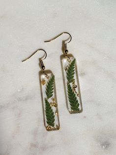 *Nickel Free* Looking for some earrings with a cottage-core aesthetic? Look no further! These small earrings have small ferns and gold flake in resin, and are super lightweight. Resin Earring, Gold Flake, Real Flower Jewelry, Cottage Core Aesthetic, Botanical Jewelry, Aesthetic Look, + Core + Aesthetic, Gold Flakes, Unique Handmade Jewelry