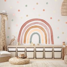 a child's room with a rainbow wall decal