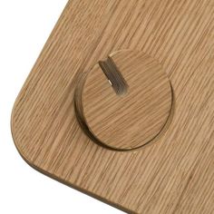 a close up of a wooden object on a white background