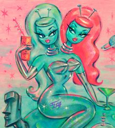 two mermaids are sitting next to each other with drinks in their hands and one is holding