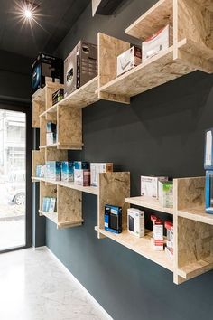 the shelves are lined up against the wall