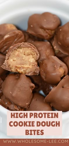 chocolate covered cookie dough bites in a white bowl with text overlay that reads high protein cookie dough bites