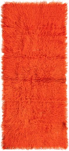 an orange shaggy rug is shown on a white background and it's very soft