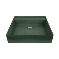 a green square sink with a gold faucet in the middle and a white background