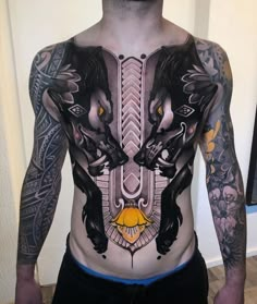 a man with tattoos on his body and chest