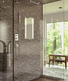 a bathroom with a walk in shower next to a wooden table