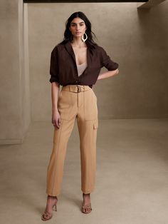 Utility with a twist, this cargo pant is crafted using a luxurious and softly structured fabric, enhanced with advanced stretch for a refined look and feel.  SLIM FIT: High waisted, slim through hip and thigh, tapered leg.  Ankle length.  Zip fly with hook and bar closure.  Removable belt.  Front, back and side cargo pockets.  Pleated detail at the cuff.  Unlined.  SLIM FIT: High waisted, slim through hip and thigh, tapered leg.  Ankle length.  Ankle length.  Inseams: Petite/Short 24", Regular 2 Cargo Pants Outfit, Tan Pants, Cargo Pant, Style Mistakes, Slim Pants, Business Casual Outfits, Looks Style, Bottom Clothes, Look Chic