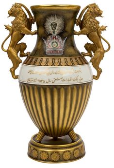 an ornate vase with two lions on it