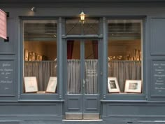 an image of a store front with pictures in the window