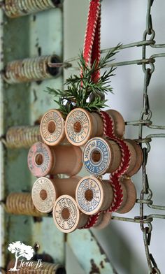 an assortment of wooden spools hanging from a wire