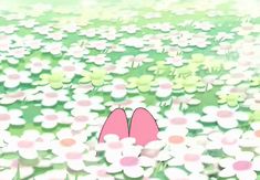 two pink shoes are in the middle of a field of flowers