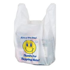 a plastic bag with a smiley face on it that says, have a nice day thanks for shopping here