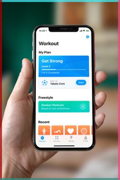 someone is holding up their phone to check out the workout app on their iphone screen