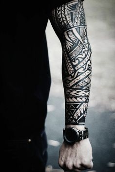 a man with a tattoo on his arm