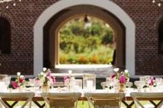 a table set up for a formal dinner outside