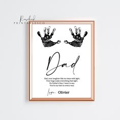 a framed print with the words dad and two hands on it, in black ink