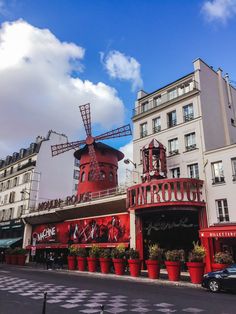 a large red building with a windmill on top