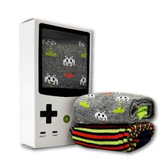 80s Retro Game Nostalgia Fun Unisex Socks 2 Pair Gift Set 80s Retro Game Nostalgia Fun Unisex Socks 2 Pair Gift Set Super fun 80s game-themed socks feature space invaders all-over print and retro stripes, and it comes in a cool retro game console inspired gift box! Who doesn't like games and socks? it's the perfect holiday gift for anyone! Fits Men's and women's Sizes UK - 6 - 11 (US 7-12) Gift box dimension: 6.25" x 3.5" x 1.5" Fibre Composition: Grey Sock: 59% Cotton, 22% Polyamide, 18% Polyes Retro Games Console, Grey Socks, Ladies Gents, Gift Box Design, Socks Gift, Sock Game, Retro Game, Retro Stripes, Pac Man