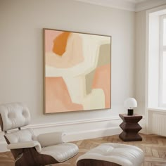 an abstract painting hangs in the corner of a room with two chairs and a lamp