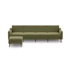 a green couch and footstool on a white background