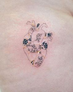 a woman's stomach with flowers and hearts on the side, as if it were made out of paper