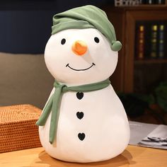 a snowman sitting on top of a wooden table