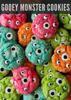 colorful cookies with gooey monster eye eyes on them are ready to be eaten for halloween