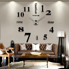 a living room filled with furniture and a large clock mounted to the wall above it