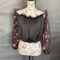 Shein Long Sleeve Off Shoulder Crop Top. Sleeves Are Sheer No Tags Was Ordered Online Black Tops With Floral Embroidery For Night Out, Black Top With Floral Embroidery For Night Out, Black Blouse With Floral Embroidery For Night Out, Black Crop Top Blouse For Spring, Trendy Black Tops With Floral Embroidery, Chic Black Tops With Floral Embroidery, Spring Night Out Blouse With Floral Embroidery, Spring Black Blouse For Night Out, Spring Floral Embroidered Blouse For Night Out