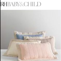 four pillows stacked on top of each other with the words baby and child above them