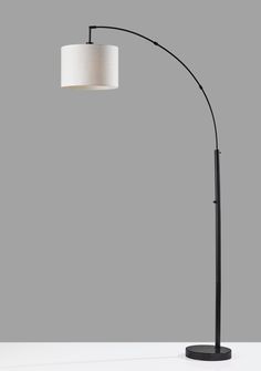 A smart and stylish way to light up a seating area, the Bowery Arc Lamp provides overhead lighting that can be controlled with an adjustable shade. Aside from functional assets, a matte black finish is paired with a black marble base to display striking style. An 100 Watt bulb shines beautifully through a taupe textured fabric shade. This unique mix of materials creates a beautiful, classy look adding modern farmhouse vibes to any home. An on/off rotary switch is placed conveniently on the pole. Adesso Bowery Arc Lamp 73.5-in Black Arc Floor Lamp | 4249-01 Arc Floor Lamp, Arched Floor Lamp, Arc Lamp, Round Light, Overhead Lighting, Arc Floor Lamps, Black Lamps, Black Marble, Textured Fabric