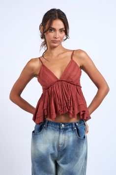 The Lexi Cinnamon Ruffle Babydoll Cami Top is not just another top! It's the perfect layering piece. Beautiful red rust fabric with eyelet lace detail on the bust forms this unique babydoll crop top. Cotton fabric creates a V-neck babydoll bodice with adjustable cami straps and ruffle cropped hem. Sexy like a lingerie and can be worn under a cardigan as a camisole top with extra layers. Makes a great addition to your wardrobe for picture day, apple picking, brunch dates, date night and more casu Top With Tie Straps, Babydoll Cami Top, Bust Form, Babydoll Tops, Rust Fabric, Babydoll Cami, Brunch Dates, Babydoll Shirt, Boho Pink